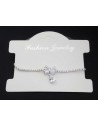Bracelet fin ajustable pendentif noeud et zirconiums